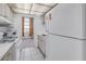 Compact kitchen with essential appliances and a bright, clean appearance at 5840 30Th S Ave # 208, Gulfport, FL 33707