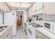 Fully-equipped kitchen offers a practical layout and ample counter space at 5840 30Th S Ave # 208, Gulfport, FL 33707