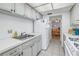 Well-lit kitchen showcasing ample counter space and efficient design at 5840 30Th S Ave # 208, Gulfport, FL 33707