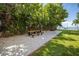 Scenic picnic area with wooden tables, gravel base, and lush trees overlooking the water at 5840 30Th S Ave # 208, Gulfport, FL 33707
