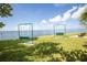Lawn with swing sets overlooking scenic water views providing an ideal outdoor space at 5840 30Th S Ave # 208, Gulfport, FL 33707