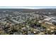 Sprawling aerial view of a residential neighborhood showcasing lush greenery and nearby commercial areas at 5891 64Th N St, St Petersburg, FL 33713