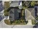 Overhead view of the home showing the landscape, neighboring houses, and driveway at 5891 64Th N St, St Petersburg, FL 33713