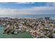 Aerial view of the home showing the waterfront location close to the beach, and the community at 7013 Boca Ciega Dr, St Pete Beach, FL 33706