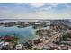 Aerial view of waterfront home with water access to Tampa Bay and Gulf of Mexico at 7013 Boca Ciega Dr, St Pete Beach, FL 33706