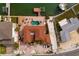 Aerial view of backyard with pool, patio, and dock with boat lift on deep water canal at 7013 Boca Ciega Dr, St Pete Beach, FL 33706