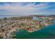 Waterfront property offers a birds eye view of the coastline, town, and canals at 7013 Boca Ciega Dr, St Pete Beach, FL 33706