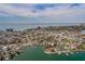 Waterfront property offers stunning aerial view of coastline, city, and inshore canal at 7013 Boca Ciega Dr, St Pete Beach, FL 33706