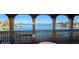 Balcony view with white railings showcasing beautiful waterfront at 7013 Boca Ciega Dr, St Pete Beach, FL 33706