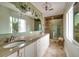 Elegant bathroom featuring a granite countertop and glass shower at 7013 Boca Ciega Dr, St Pete Beach, FL 33706