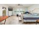 Bright bedroom with water views, tiled flooring and an exterior door at 7013 Boca Ciega Dr, St Pete Beach, FL 33706