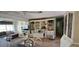Cozy dining area with built-in shelving, open to living area, featuring a blend of textures and inviting décor at 7013 Boca Ciega Dr, St Pete Beach, FL 33706