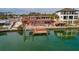 Waterfront home with a private dock, outdoor kitchen, swimming pool, and space for entertaining at 7013 Boca Ciega Dr, St Pete Beach, FL 33706