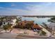 Waterfront home with beautiful brick drive, mature landscaping and direct access to the bay at 7013 Boca Ciega Dr, St Pete Beach, FL 33706