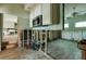 Kitchen under renovation with exposed framing and tile backsplash, offering a customizable design with a modern layout at 7013 Boca Ciega Dr, St Pete Beach, FL 33706