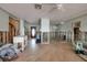 Large, gutted living room with tile floor, stairs, and front door visible, ready for renovation and customization at 7013 Boca Ciega Dr, St Pete Beach, FL 33706