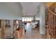 Spacious living room in need of renovation, features tile floor and staircase at 7013 Boca Ciega Dr, St Pete Beach, FL 33706