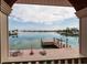 Covered patio with brick flooring offers a scenic water view at 7013 Boca Ciega Dr, St Pete Beach, FL 33706