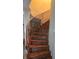 Curved staircase with decorative tile risers and custom railings at 7013 Boca Ciega Dr, St Pete Beach, FL 33706