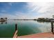 Beautiful waterfront view from a dock with tranquil waters and lush surroundings, perfect for relaxation at 7013 Boca Ciega Dr, St Pete Beach, FL 33706