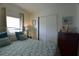 Relaxing bedroom with comfortable bed, closet space and decorative accents, and a nautical theme at 7129 El Rancho Way, Zephyrhills, FL 33541