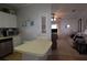Functional kitchen with white cabinets, stainless steel appliances, and a breakfast bar at 7129 El Rancho Way, Zephyrhills, FL 33541