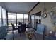 Inviting sunroom with comfortable seating and ample natural light, perfect for relaxation at 7129 El Rancho Way, Zephyrhills, FL 33541