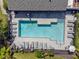 Aerial view of the community pool. Lots of lounge chairs around the pool at 8835 Moonlit Meadows Loop, Riverview, FL 33578