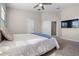 Bedroom features a large bed with a large TV attached to the wall at 8835 Moonlit Meadows Loop, Riverview, FL 33578