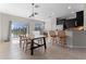 Bright dining room with lake view, tiled floors, and wooden dining table at 8835 Moonlit Meadows Loop, Riverview, FL 33578