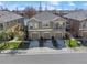 Aerial view of a two story townhome featuring three car garages and an open balcony at 8835 Moonlit Meadows Loop, Riverview, FL 33578