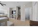 Open-concept living room featuring tile floors, a television, and staircase at 8835 Moonlit Meadows Loop, Riverview, FL 33578