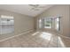 Bright bedroom featuring a large window providing lots of natural light at 10251 Oasis Palm Dr, Tampa, FL 33615