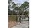 Gated dog park entrance featuring separate sections for small and large dogs, providing a safe play area at 10251 Oasis Palm Dr, Tampa, FL 33615