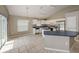 Bright kitchen featuring an eat-in island, stainless steel appliances, tile floor, and neutral color scheme at 10251 Oasis Palm Dr, Tampa, FL 33615