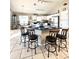 Bright kitchen features a central island with barstool seating and modern appliances at 10251 Oasis Palm Dr, Tampa, FL 33615