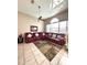 Open living room features tiled floors, ceiling fan, and cozy sectional sofa at 10251 Oasis Palm Dr, Tampa, FL 33615
