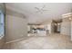 Open living space includes a ceiling fan and flows into the kitchen at 10251 Oasis Palm Dr, Tampa, FL 33615