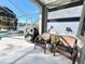 View of screened-in patio, seating area, and outdoor grill at 10251 Oasis Palm Dr, Tampa, FL 33615
