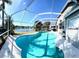Beautiful pool area with screened lanai, ideal for outdoor living and enjoyment at 10251 Oasis Palm Dr, Tampa, FL 33615
