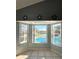Bay windows with a view of the pool and surrounding greenery at 10251 Oasis Palm Dr, Tampa, FL 33615