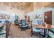 Dining area featuring neutral walls, high ceilings, carpeted floors and comfortable seating at 11044 Jenkins Ct, San Antonio, FL 33576