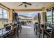 Outdoor seating with shade covering overlooking a lush green landscape at 11044 Jenkins Ct, San Antonio, FL 33576