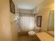 Bathroom featuring a shower, toilet, and vanity at 11470 88Th Ter, Seminole, FL 33772
