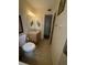 Bathroom featuring a vanity area, toilet, and access to the shower-tub area at 11470 88Th Ter, Seminole, FL 33772