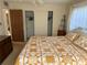 This spacious bedroom has a comfortable bed, a closet, and soft natural light at 11470 88Th Ter, Seminole, FL 33772