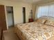 This cozy bedroom features a comfortable bed and spacious closet for ample storage at 11470 88Th Ter, Seminole, FL 33772