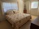 Bright bedroom featuring a comfortable bed, window, and soft natural light at 11470 88Th Ter, Seminole, FL 33772