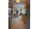 View from the kitchen featuring the dining area with chandelier, and sliding doors to the patio at 11470 88Th Ter, Seminole, FL 33772
