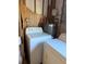 Utility room features a functional washer and dryer setup with wall-mounted water heater at 11470 88Th Ter, Seminole, FL 33772